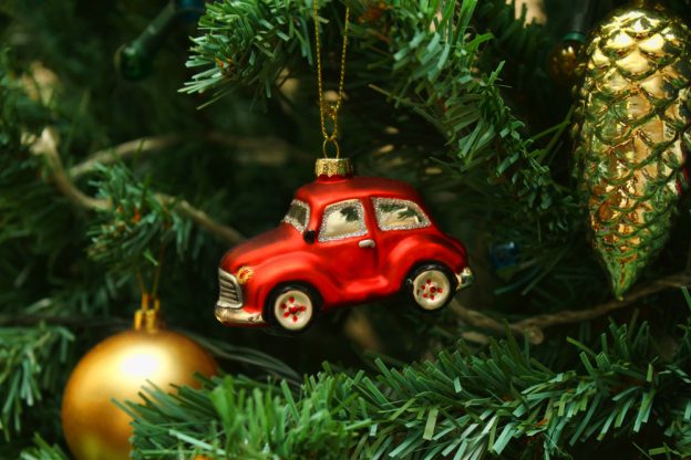 a car ornament hanging on a christmas tree